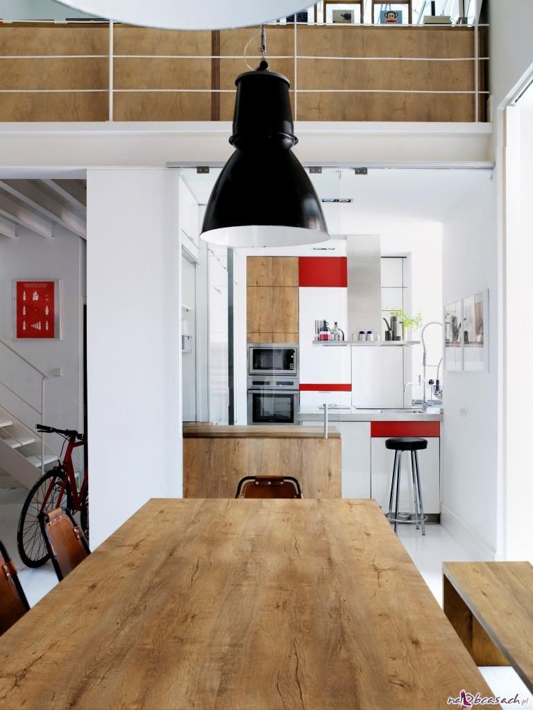 Table and chairs in spacious open plan kitchen in Spanish home