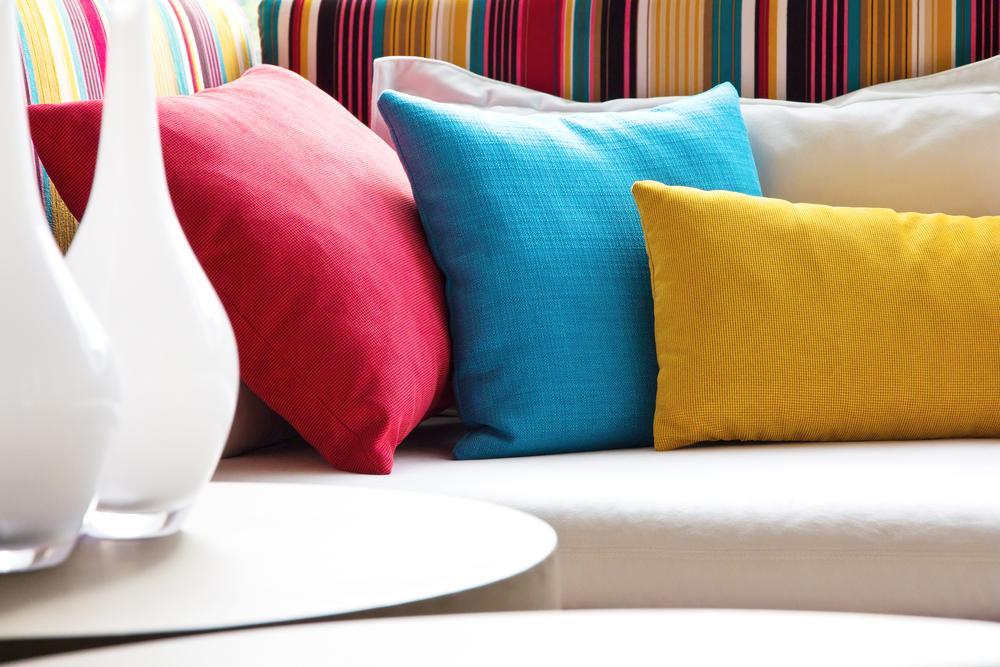 white-couch-sofa-colorful-pillows