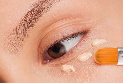 Woman applying foundation