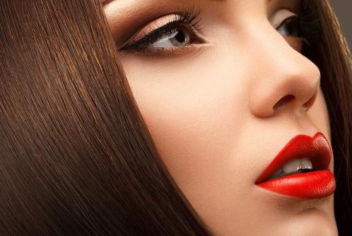 Woman Eye with Beautiful Makeup. Red Lips. High quality image.