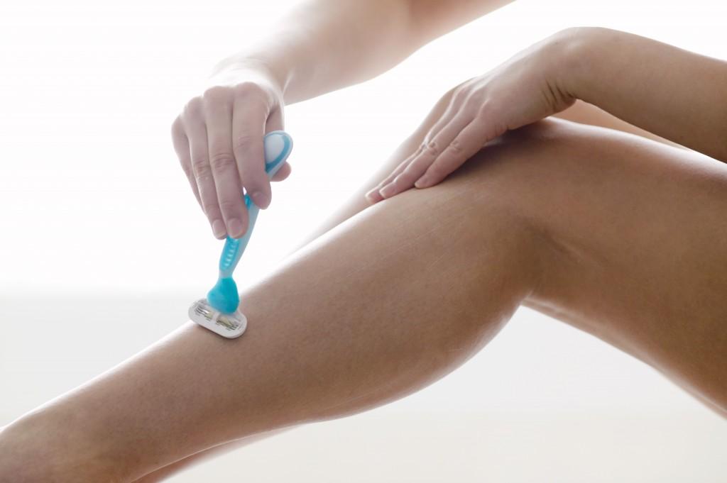 Woman Shaving Legs