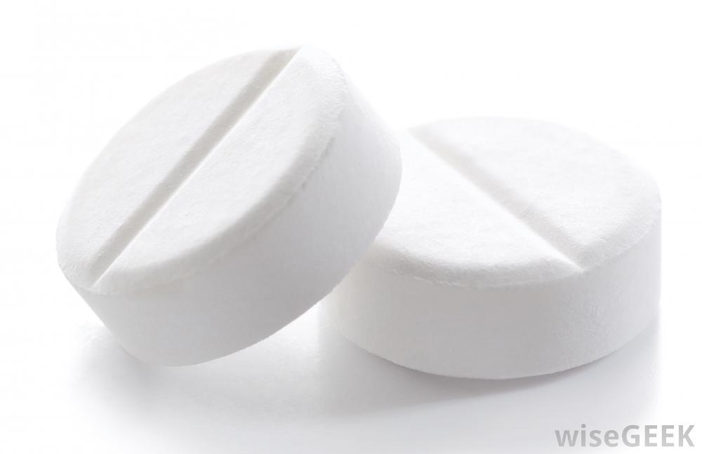 two-white-pills-against-white-background