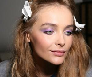 model-getting-her-makeup-done-backstage-at-versace-spring-2010-milan-fashion-week