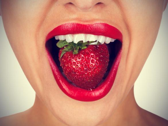 Woman-With-Perfect-White-Teeths-Eating-Strawberry