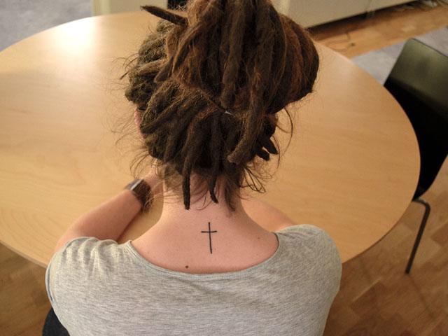 beautiful-small-cross-back-neck-tattoo