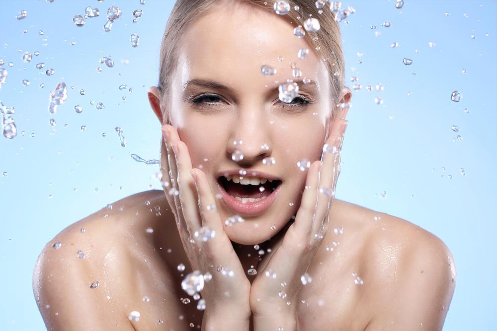 Beautiful woman washing her face