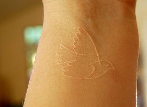 white-wrist-tattoo-design-for-women