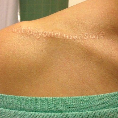 wit-beyond-measure-white-ink-tattoo-on-collarbone-for-women