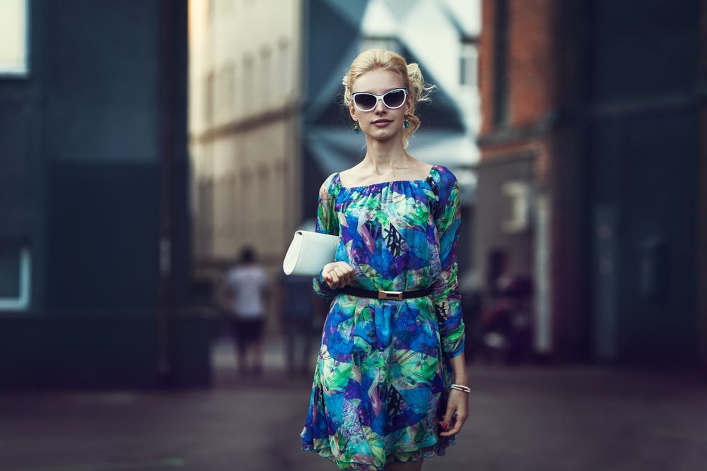 Beautiful stylish young woman on a street