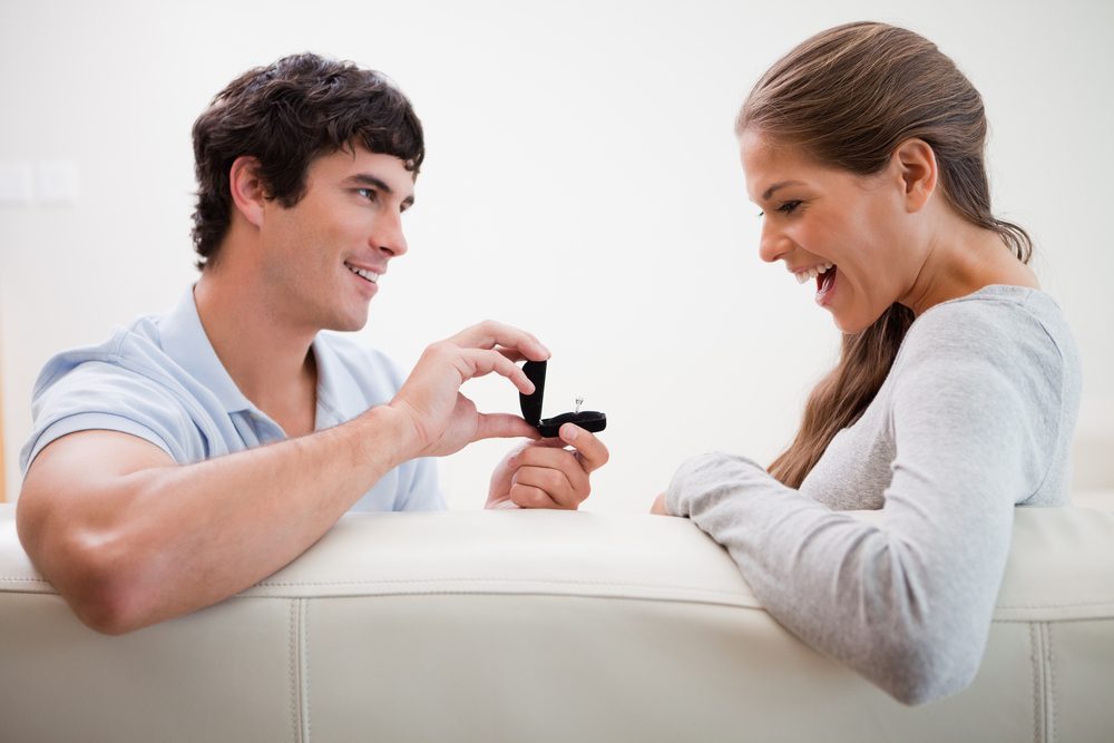 Young man making a proposal to his girlfriend