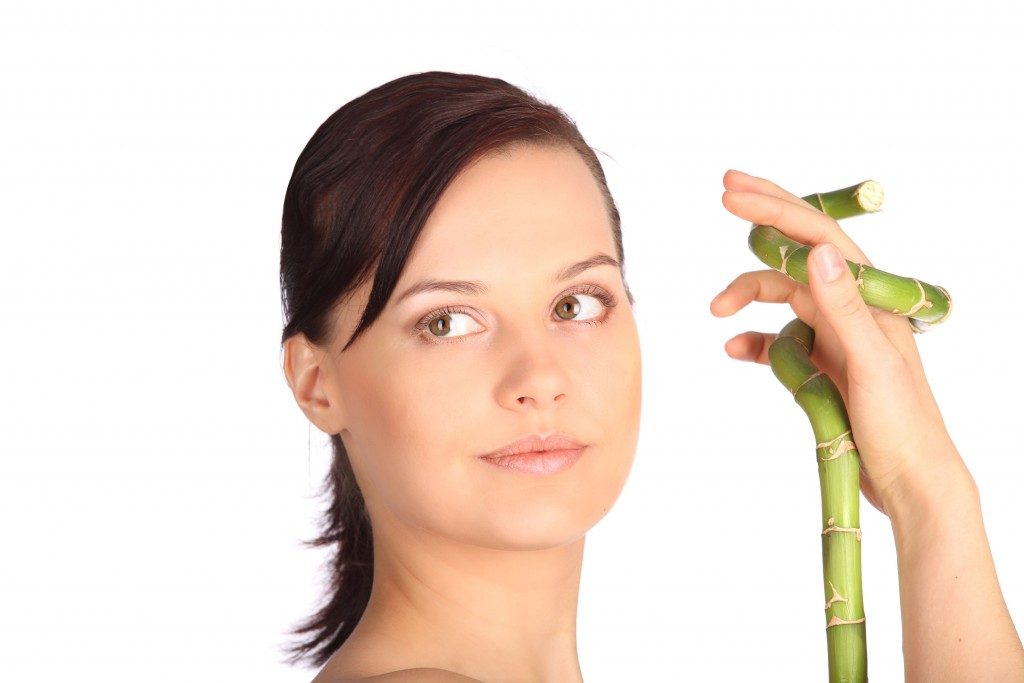 Spa woman with bamboo. Clear fresh skin studio