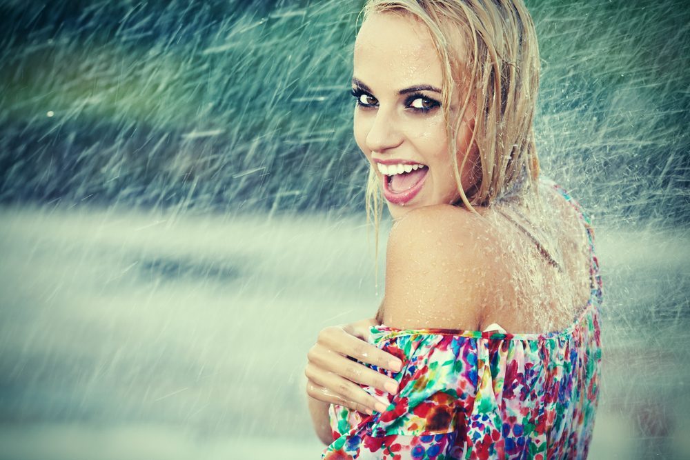 portrait of young beautiful woman in rain