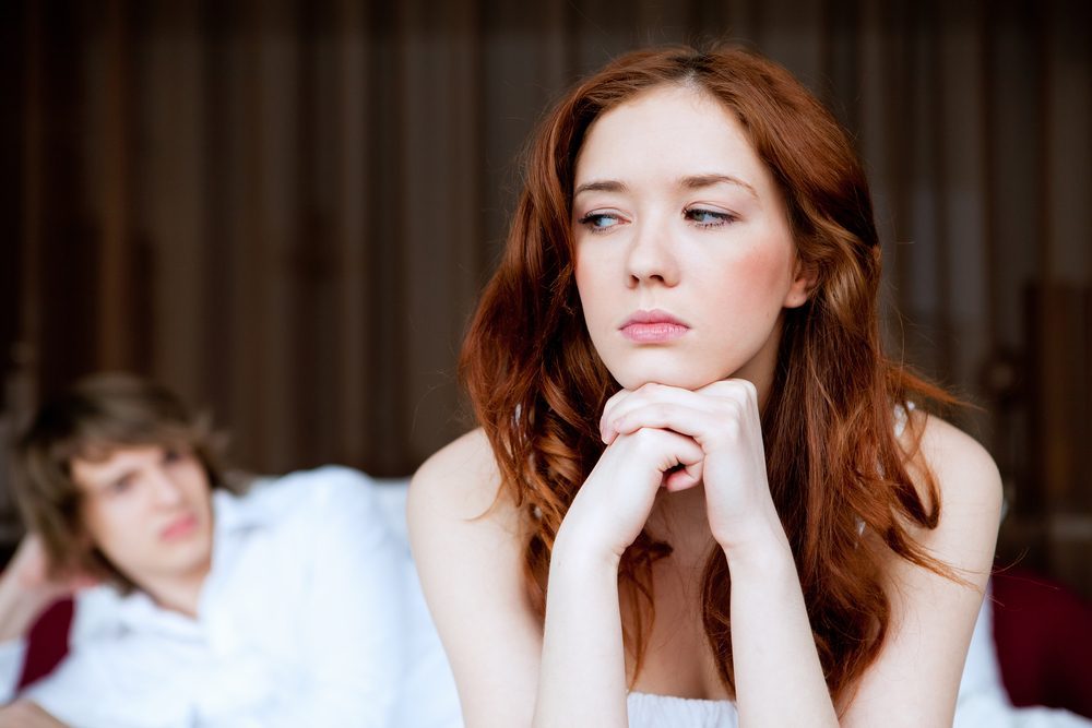 Picture of couple in disagreement in bedroom