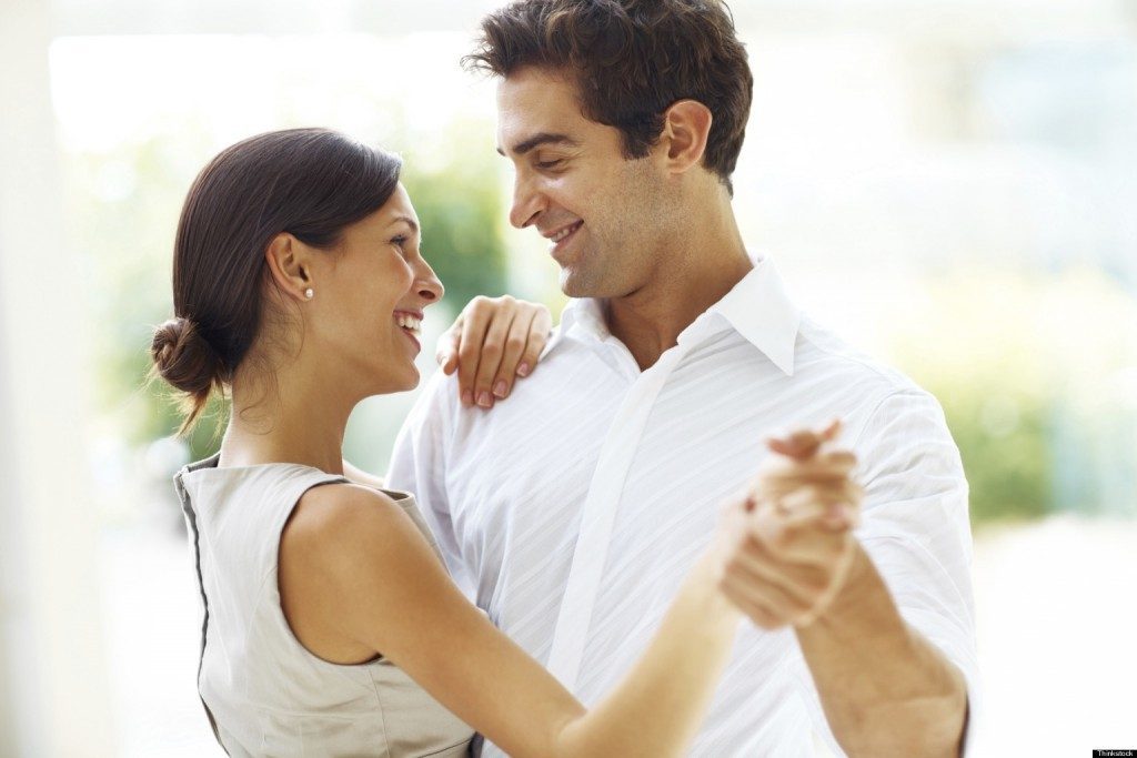 Young romantic couple dancing