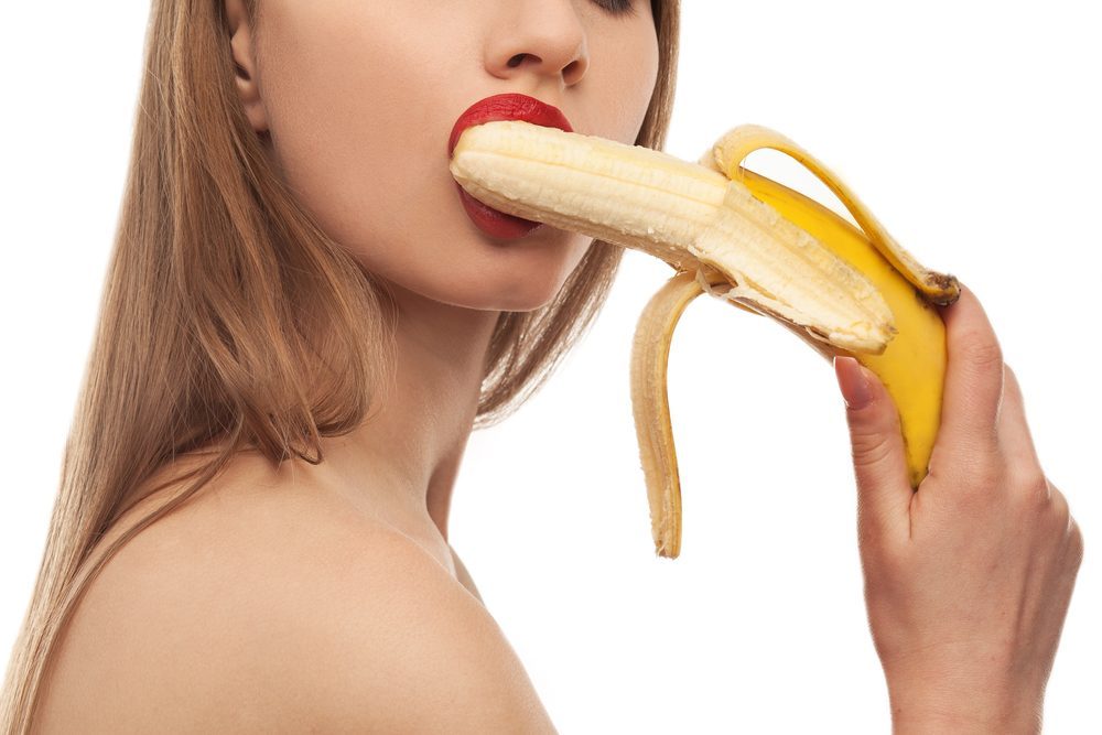 horny girl eats and licks the banana, oral sex